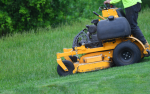 Person Using A Riding Lawnmower